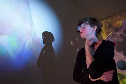 ARTY EARTH BABE : At the University Art Gallery, Oakland artist Suzy Poling’s exhibit “Into the Center of the Earth” explored what our planet’s core might look like through the use of video projection, photography, and installation. - PHOTO BY STEVE E. MILLER