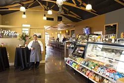 DELECTIBLE DELIGHTS GALORE: Master of the kitchen, Chef Treaver Lynch stands in the entryway to Willow, which also includes a specialty food store, bar, and deli. - PHOTO BY STEVE E. MILLER