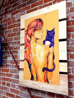 CAT LADY: Sara LeGrady's vibrant paintings adorned the walls of Tigerlily Salon as part of SLO's Art After Dark. - PHOTO BY JESSICA PEÑA