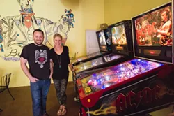 BE EXCELENT, EAT EXCELLENT: Mike and Becky Hicks encourage loitering at their neighborhood hangout, Lincoln Market. Drink a beer, grub down, or try your hand at some vintage pinball. - PHOTO BY KAORI FUNAHASHI