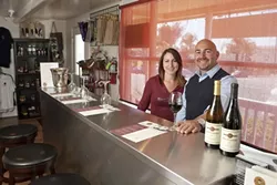 SEEING RED : David Addamo opened Red Carpet Winery in Pismo Beach this year, and his daughter Nicole manages the tasting room. The space, including the huge patio, is available for parties—and the Addamos certainly know how to celebrate. - PHOTOS BY STEVE E. MILLER