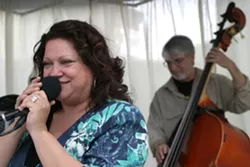 SING IT, SISTER : Diane Steinberg, Kenny Lee Lewis’ wife, belts out an awesome rendition of ZZ Top’s “Sharp Dressed Man” while bass master Ken Hustad keeps time. - PHOTO BY GLEN STARKEY