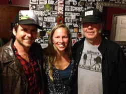 THANK YOU, GOOD MEDICINE PRESENTS!: Willie Nelson’s son Lukas Nelson (left), Good Medicine Presents co-owner Korie Newman (center), and iconic rocker Neil Young (right) joined forces to play a last minute, secret concert at SLO Brew. - PHOTO BY GLEN STARKEY