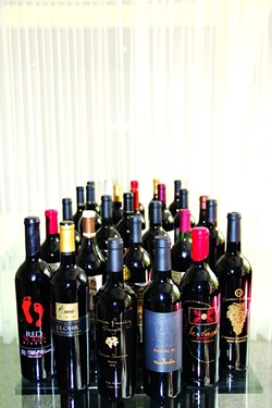 POP A CAB IN YOUR GLASS :  During a tasting of 28 cabernet sauvignon and - cabernet blends in Paso Robles&mdash;all members of the Paso Robles CAB Collective&mdash;the judges found many outstanding 2010 and 2011 wines. - PHOTO COURTESY OF PARKER SANPEI