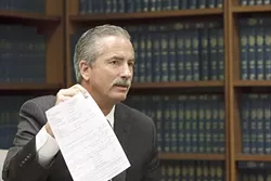 HEADHUNTER? : New internal affairs officer for the SLO County Sheriff’s Department, Jim Voge, displayed his newly created complaint form the public can use to comment on an officer's performance. - PHOTO BY STEVE E. MILLER