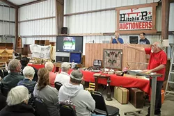 FAST MONEY : The Erpenbachs have seen a dramatic recent increase in items offered for sale in their family-run auction business. - PHOTO BY STEVE E. MILLER