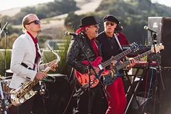 GET DOWN: Members of the band Burning James and the Funky Flames (from left to right: Brad Hackleman, “Burning” James Scoolis, and Billy Baxmeyer) perform on Tooth and Nail Winery’s rooftop patio during the Dec. 5 launch party for the new Central Coast LIVE! Internet radio app, which livestreams local musicians exclusively. - PHOTO COURTESY OF JP SAWYER OF JOHN PATRICK IMAGES