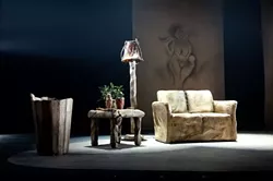 THE SET-UP: Part stand-up routine, part pseudo-anthropology, this one-man show boasts a bare bones stage, with Flintstones-style décor. - PHOTO COURTESY OF THEATER MOGUL