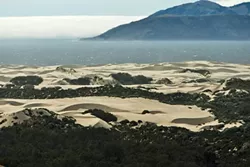 BURN MY DUST, EAT MY RUBBER : The San Luis Obispo County Air Pollution District’s plan to fine the state on days when particulate dust exceeds standards has attracted two lawsuits—now supported by the attorney general—just as administrators appeal to the state for help. - FILE PHOTO BY STEVE E. MILLER