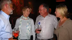 COWORKER’S LAST HOORAY : Supervisor Bruce Gibson stopped by the wine bar to back fellow board member Jim Patterson and schmooze with his supporters. With only a few precincts reporting at this point, moods were still optimistic. - PHOTO BY NICK POWELL