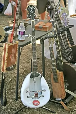 BEDPAN BANJO! : A luthier displayed a vast collection of his unusual one-of-a-kind stringed instruments in the vendors’ area.