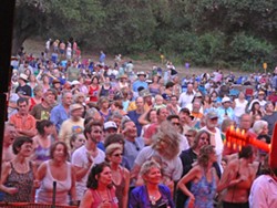BE A PART OF THE COMMUNITY :  Upwards of 5,000 people attend Live Oak Music Festival, creating a little city in a dusty campground off Hwy. 154. - PHOTO BY GARY ROBERTSHAW