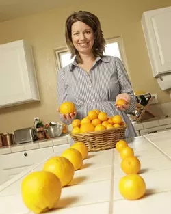 HEALTHY CHOICE : To help Oceano Elementary School students concentrate on nourishing foods, Kelly Lynch employs such tactics as a ballot for tangerines versus oranges. - PHOTO BY STEVE E. MILLER