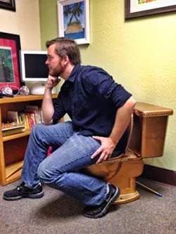 DEEP THUNKER: This is Nick Powell, sitting on the office toilet. He wanted to write something about a poop joke here. - PHOTO BY STEVE E. MILLER