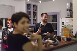 NICE!: Colin Rigley looks ready to kill someone with those tongs. That someone is probably intern Adriana Catanzarite, who clearly got in this photo. Lame! - PHOTO BY JESSICA PEÑA
