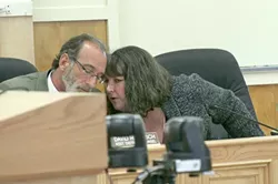 IN HOT WATER : Embattled Cambria Community Services District General Manager Tammy Rudock (pictured, right) conferred with Assistant District Counsel David Hirsch after being berated by angry residents at an April 28 board meeting. - PHOTO BY MATT FOUNTAIN