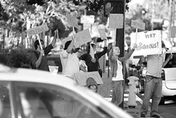 VAGUE PROTEST : On July 23 New Arts Collective staged a vague protest at the downtown Farmer’s Market in SLO. - PHOTO BY STEVE E. MILLER