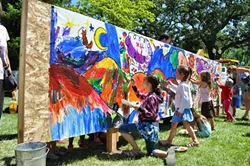 IN SITU: ARTSFEST attendees add to a communal mural. - PHOTO COURTESY OF STUDIOS ON THE PARK