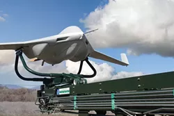 NO PILOT REQUIRED : A San Luis Obispo facility that designs and builds small unmanned aerial vehicles like this one—used by the U.S. military in Afghanistan and Iraq—has been bought by military giant Lockheed Martin. - PHOTO COURTESY OF LOCKHEED MARTIN