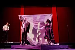 PAY NO ATTENTION TO THE SEX BEHIND THE CURTAIN!: L.A. Theatre Work’s production of The Graduate, adapted as a live radio play, incorporates visual as well as aural tricks to tell the story of Ben Braddock and Mrs. Robinson—played by Brian Tichnell and Heidi Dippold, pictured behind the bed sheet. In a simultaneous scene, Ben’s parents—played by Tom Virtue and Diane Adair—hold the sheet aloft, oblivious. Darren Richardson plays the psychiatrist in the left hand corner. - PHOTO BY MATT PETIT
