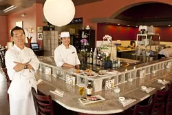 WRAP AND ROLL: Restaurateur Bruce Lee and chef “Cat Fish” Kim present culinary delights such as a beef tataki wrap, salmon avocado wrap, tuna tataki wrap, and sashimi salad wrap. - PHOTO BY STEVE E. MILLER