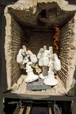The molds are placed in an oven that melts away the wax and heats it to a temperature appropriate for pouring the molten bronze into. - PHOTO BY STEVE E. MILLER