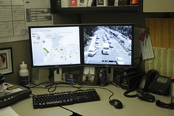 TOTAL CONTROL :  From his cubicle in the SLO Public Works Department, Senior Traffic Engineer Jake Hudson can at any time access video feeds from traffic cameras throughout the city. - PHOTOS BY STEVE E. MILLER