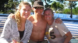 WINNER WINNER CHICKEN DINNER : Lindsey Whitaker, Travis Robertson, and Carly Schleppenbach relaxed in the beer garden after crushing the Mud Mash. Finishing in one hour and 12 minutes, Travis had the best time for the 10K. - PHOTOS BY NICK POWELL