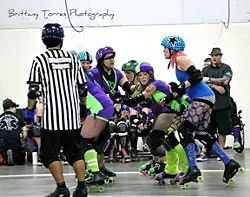 EYE OF THE STORM: The pack is a dangerous place for any jammer and the Broad St. Brawlers showed the Nor Cal Roller Girls no mercy on Saturday night. - PHOTO BY BRITTANY TORRES PHOTOGRAPHY