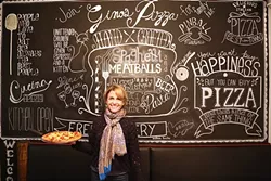 HERE TO SERVE: Gino’s Pizza Owner Consuelo Dias is a powerhouse of hospitality. Her mission: to serve the freshest pizza to all walks of life. - PHOTO BY DYLAN HONEA-BAUMANN