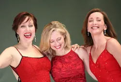 RED AS SANTA: Karen Culliver, Mary D’Arcy, and Teri Bibb put on a show that embodies the holly, jolly spirit of the season. - PHOTO COURTESY OF THE PHANTOM’S LEADING LADIES