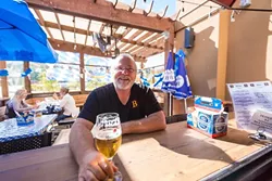 THE BIER MAN : Beda Schmidthues and his wife, Helga, are pouring their heart, soul, and delicious family recipes into the hearty offerings at Beda’s Biergarten. - PHOTO BY KAORI FUNAHASHI