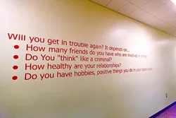 THOUGHT CRIMES: A sign inside the juvenile hall asks kids to consider their own risk of recidivism. - PHOTO BY KAORI FUNAHASHI