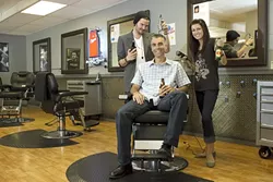 HAIRCUT HEAVEN : Owner Brian Osgood (center) decided to open a place where guys can get a good haircut and a beer. This summer enter to win at Clippers and you might get free haircuts for life under the trimmers of stylists Blake Straight and Kristen Charbonneau. - PHOTO BY STEVE E. MILLER