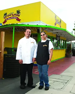 FAMILY FOOD: Jose and Grissel Rojas, owners of Frutiland—La Casa Del Sabor, stand proudly in front of their small restaurant where they make food with big flavors. - PHOTO BY STEVE E. MILLER