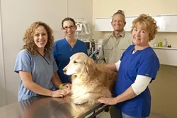 OPEN FOR ALL : (l-r) Amy Aguilera, Molly Minnis, Kevin Toman DVM, Diane Toman, and Brook the dog are at Mission Animal Hospital, which offers herbal, nutritional, and homeopathic treatment, along with traditional medicine, to help improve a pet’s quality of life. - PHOTO BY STEVE MILLER