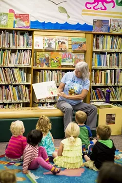 TALES FOR TOTS: Summertime reading is a good way to prevent kids from forgetting what they learned during the school year. - PHOTO BY HENRY BRUINGTON