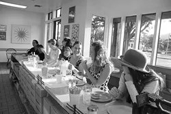 RETRO DONUT FORMAL : On Aug. 11 nearly a dozen donut-lovers assembled for a formal dining experience at Sunshine Donuts. - PHOTO COURTESY OF NOTHING HAPPENED HERE