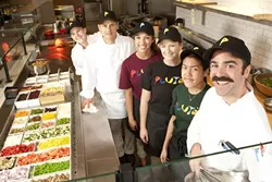 OUT-OF-THIS-WORLD FOOD : Part of the Pluto’s team stand ready to serve. Pictured are (back to front) Josie Jespersen, Stacy Benson, Dana Pearson, Melissa Sullivan, Karen Diep, and Preston King. - PHOTO BY STEVE E. MILLER