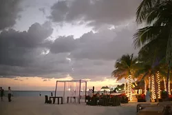 SUNSET IN PARADISE: El Sol falls on the wedding reception, but even after the wedding party is kicked out of the hotel, they club hop well into the morning. - PHOTO BY GLEN STARKEY