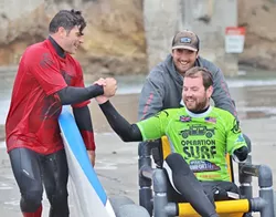 SALT WATER THERAPY : Operation Surf helps veterans heal their wartime injuries by getting them onto a surfboard and into the ocean. - PHOTO COURTESY OF AMAZING SURF ADVENTURES