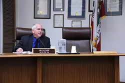 ABSENT : Edward Arnold’s chair at the Arroyo Grande city council sits empty. - PHOTO BY ROBERT A. MCDONALD