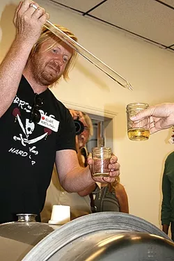 TASTE MAKER: Bristols Cidermaker Adam Welch pours a taste from the operation’s new barrel room, located just across the way from the tasting room and production facility in Atascadero. - PHOTO BY HAYLEY THOMAS