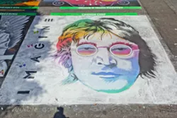 DOUBLE FANTASY: The street painting festival attracts varied and vibrant works of art like last year’s entry from Cannon Corp., a stunning, rainbow John Lennon. - PHOTO BY JOSEF KASPEROVICH