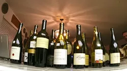 WINES ON PARADE: Sixteen bottles and countless brain cells were sacrificed to bring New Times readers the truth about wine expertise. - CHRISTOPHER GARDNER