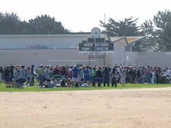 FLUSHED OUT : Hundreds of Morro Bay High School students occupied the campus athletic fields while police investigated a bomb threat Tuesday morning. - PHOTO BY PATRICK M. KLEMZ