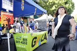 WEEKLY EVENT : Shannon Wyndsong staffs the Gay and Lesbian Alliance booth at San Luis Obispo's Farmers' Market each week. She believes that the booth is a great educational opportunity, letting people know about the local lesbian, gay, bisexual, and transgender community beyond the Pride events.