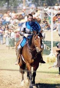 A KNIGHT OUT :  The Knights of the Crimson Rose that's Sir Tyler on the horse will bring full-contact jousting to the faire this year.