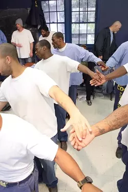 LIGHT OF FOOT : Inmate performers rehearse an Elizabethan dance the day before opening night. - PHOTO BY STEVE E. MILLER