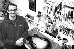 STRINGS ATTACHED : Butch Boswell, owner of Butch's Guitar Repair in the Creamery, has been mending guitars, banjos, mandolins, and more for more than a decade on the Central Coast. - PHOTO BY MEGAN MASTACHE